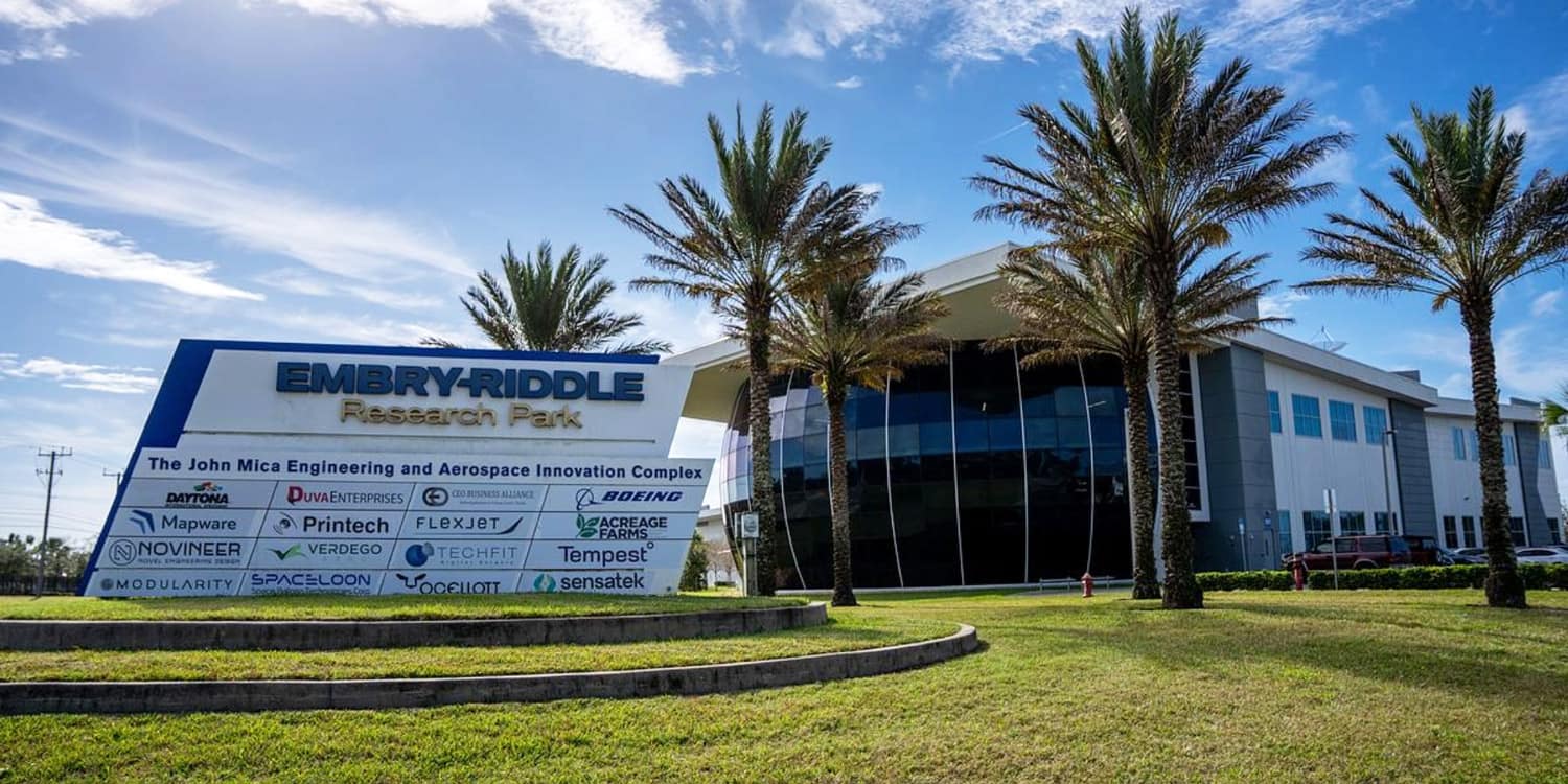 Embry-Riddle's Micaplex with palm trees in the foreground