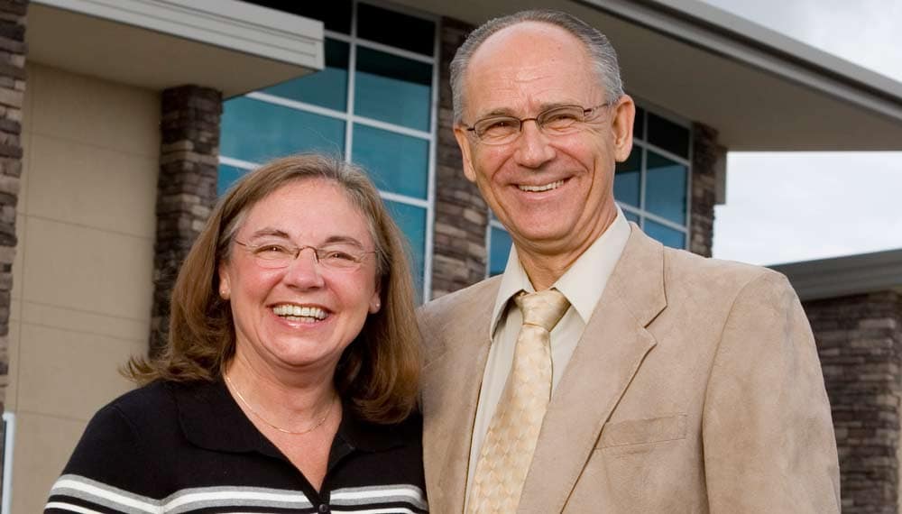 a man and woman smiling