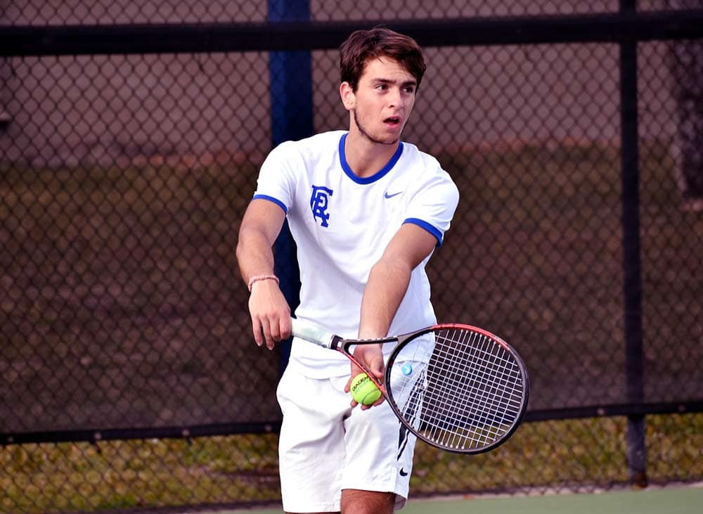 Alvaro Diaz Rodrigo prepares to serve on the tennis court