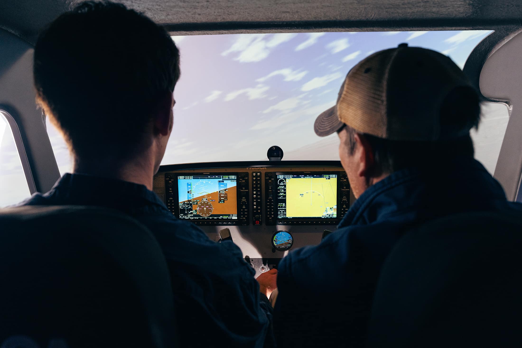 Two men in an aircraft simulator