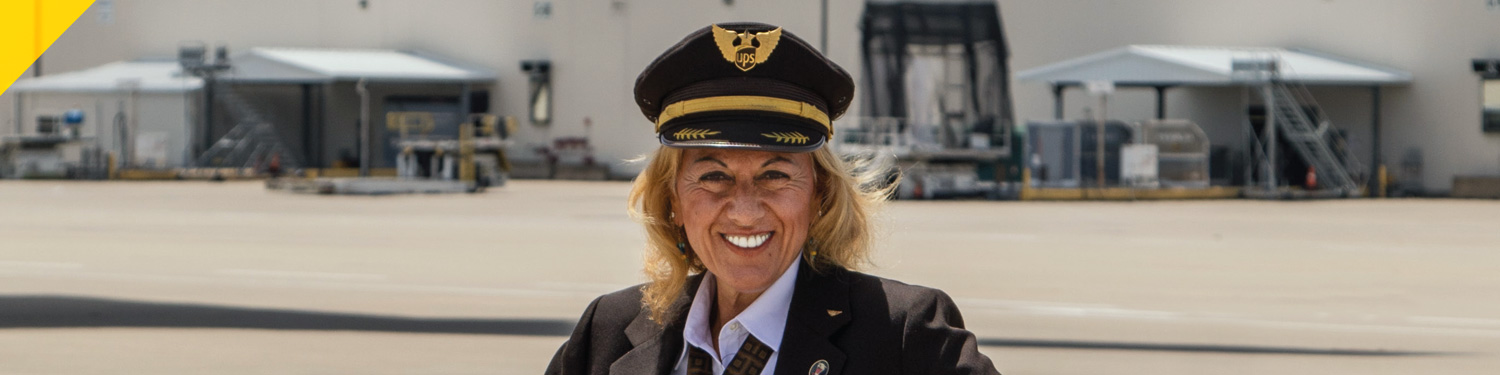 Alumna wearing pilot's uniform