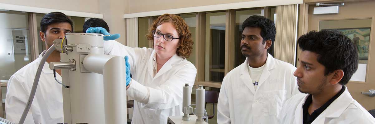 Students and a faculty member performing an experiment at Embry-Riddle.