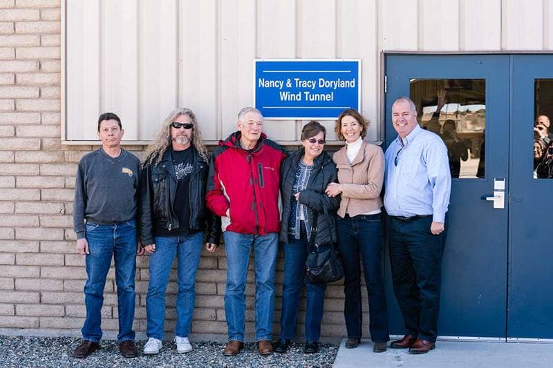 Todd Peterson, Todd Padget, Professor Tracy Doryland, Nancy Doryland, Peg Billson and Charles ‘Chuck’ Story stands in from of Doryland wind tunnel
