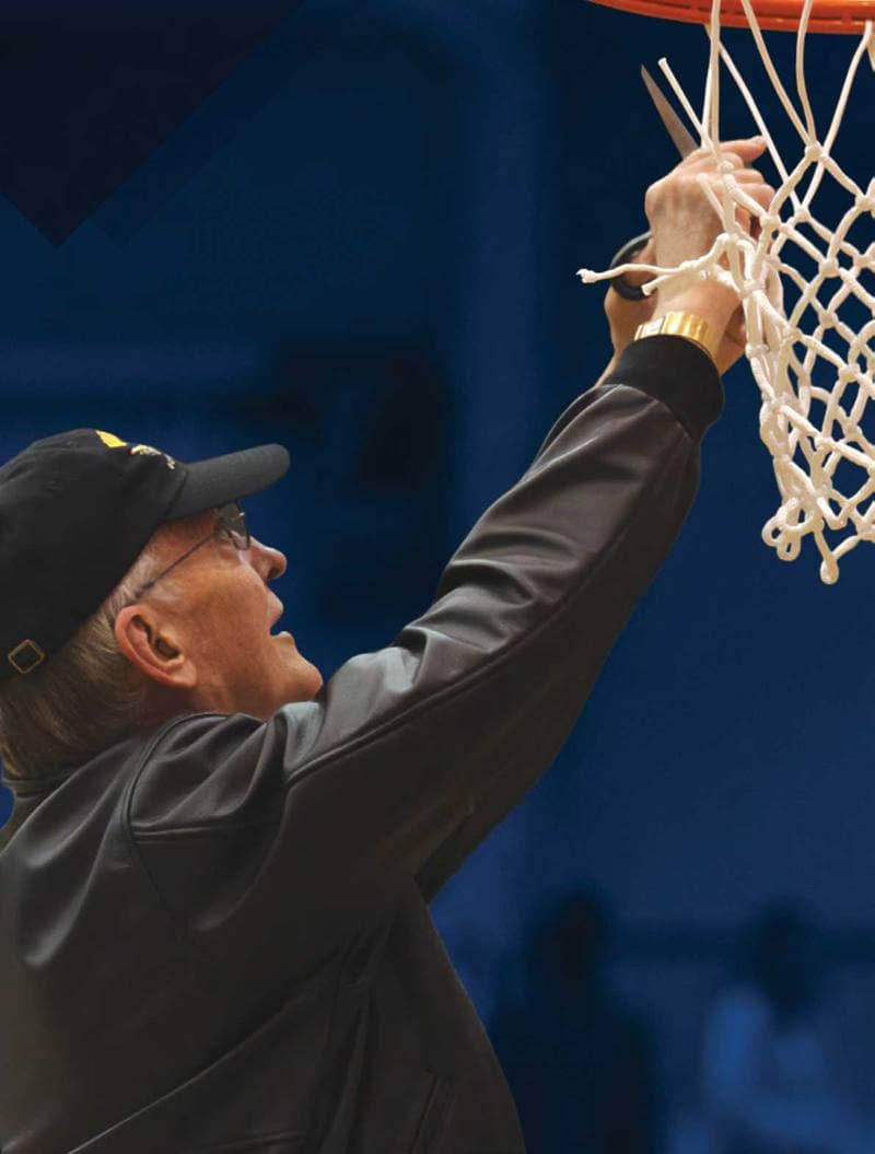 Jay Adams cuts down basketball net