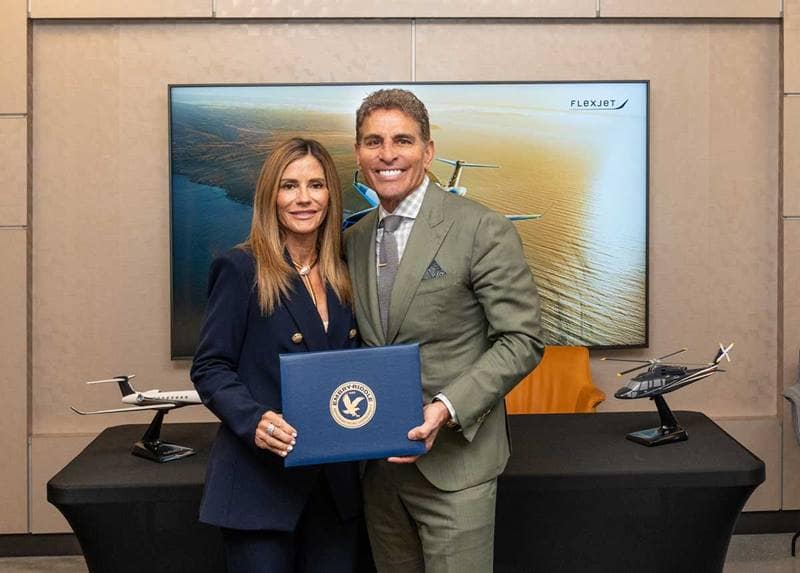 Pamela and Ken Ricci hold signed agreement to establish endowed chairs