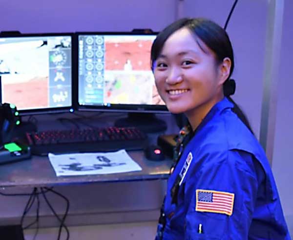 Sakurako Kuba in front of computer screens