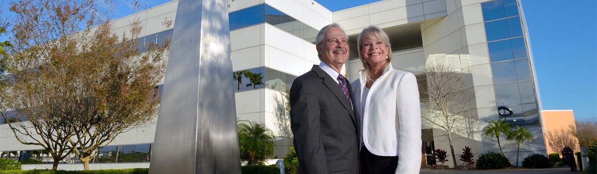 Charles and Elizabeth Duva standing outside the Engineering building at Embry-Riddle in Daytona Beach