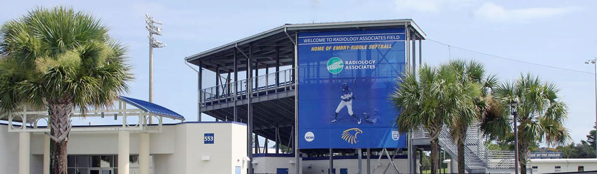 ERAU baseball field stands with Radiology Associates banner hanging from the roof