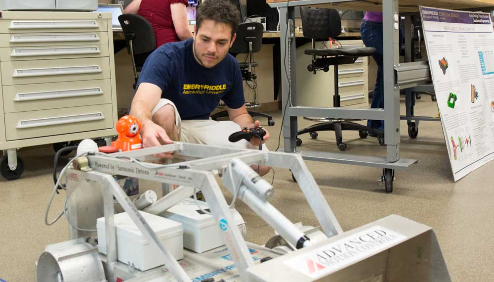 Student works on an autonomous vehicle.