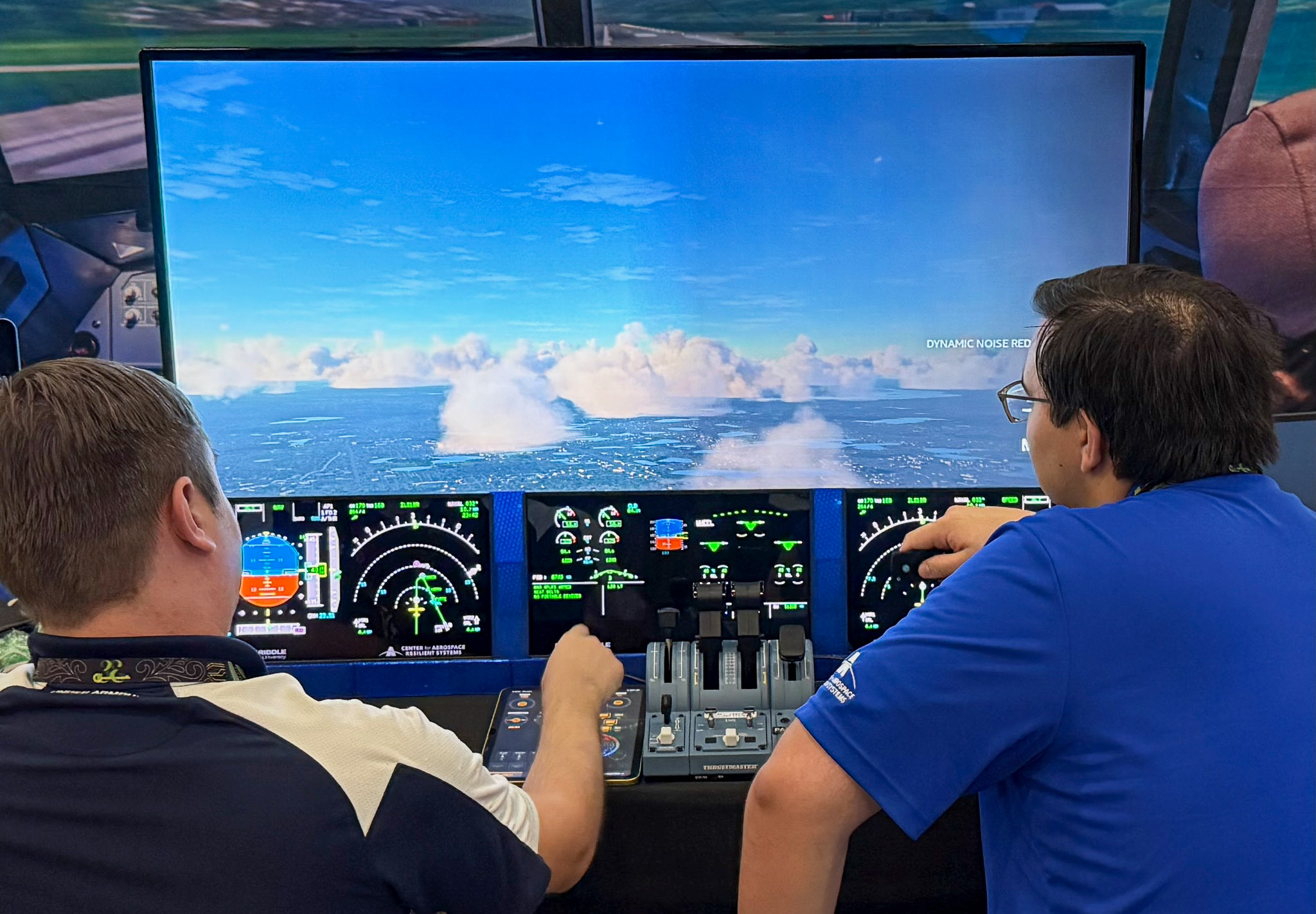 Software engineer Jake Neighbors and intern Payton Macias conduct a test run of a flight simulator developed by Embry-Riddle’s Center for Aerospace Resilient Systems (CARS). They were part of a team that showed off the simulator at the DEF CON cybersecurity event in Las Vegas.