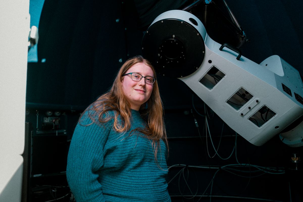 Embry-Riddle Astronomy student, Sola Nova, inside the Prescott Campus Observatory.