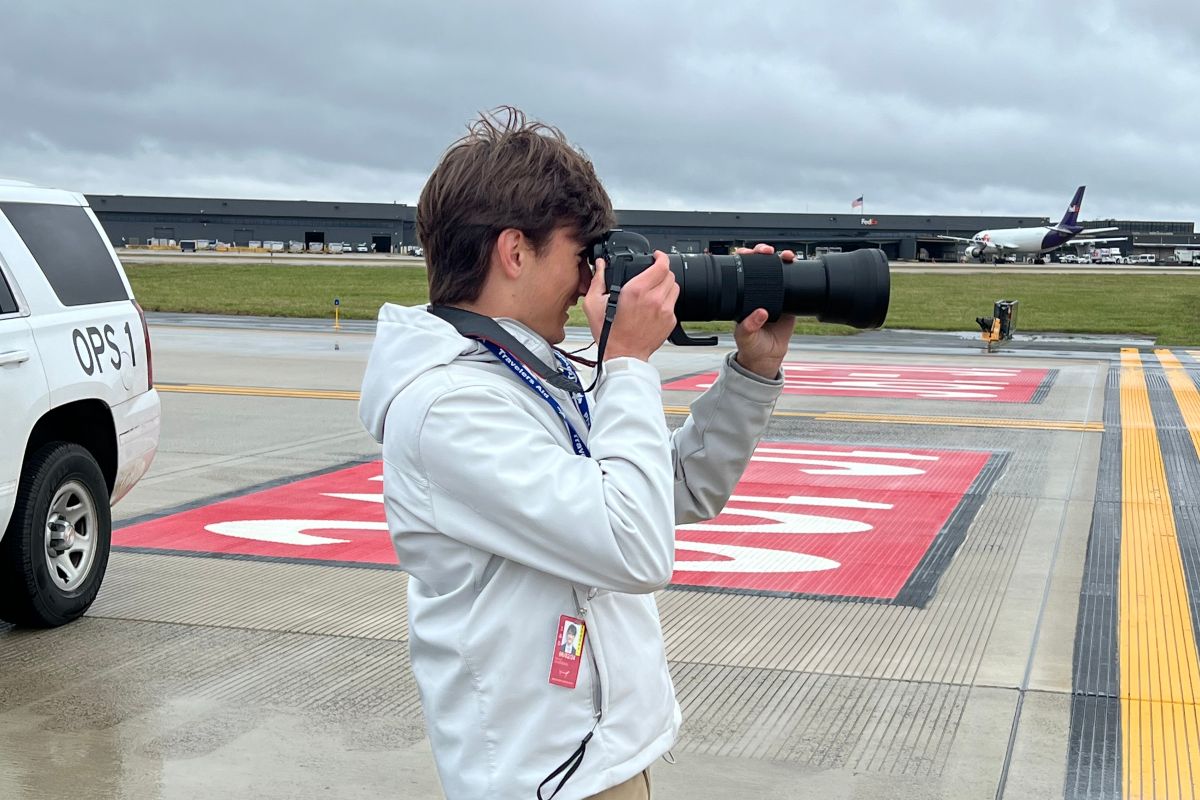 Embry-Riddle undergraduate Noah Escobar photographs aircraft from the ramp while plane spotting at Washington Dulles International Airport in Virginia.
